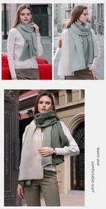Detail of soft ribbed cashmere-like scarf showing premium knit texture and pleated design