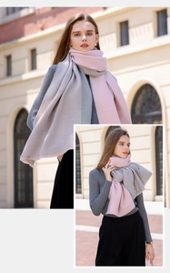 Detail showing the vertical ribbed knit texture and pink-grey color block of the scarf