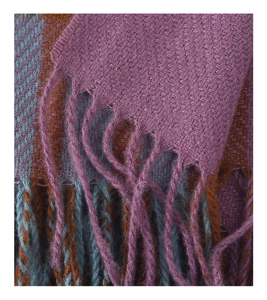 Detailed view of thick plaid scarf featuring twill weave texture and fringe tassels