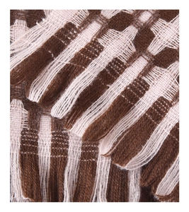 Close-up of thick knit check scarf with tassel detail in dark brown and beige
