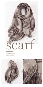Close-up of vintage plaid scarf texture with soft natural fringe and woven tassels