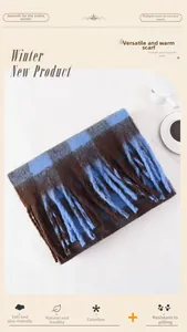 Detail of blue and brown plaid scarf featuring long fringe and soft plush fabric texture