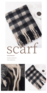 Close-up of the thick plaid texture and soft fringe detail on a 200cm winter scarf