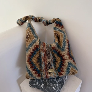 Winter knitted drawstring bag with retro geometric pattern and handmade gold tag