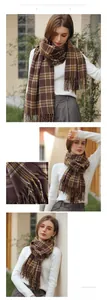 Detail of soft cashmere feel brown plaid scarf featuring elegant yellow stripes and fringe