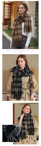 Detail of classic plaid scarf with tassels in brown and monochrome cashmere texture