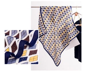 Detail shot of diamond lattice silk scarf with fine stitching and smooth fabric texture