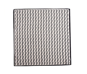 Detail of the high-quality silk scarf edge with black and white monogram letter prints