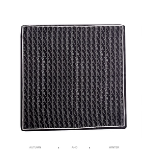Detail of square silk scarf with black and white B-monogram pattern and diagonal lines
