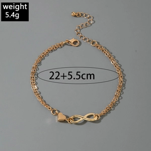 Detail view of a 5.4g gold infinity and heart layered anklet with 22+5.5cm sizing