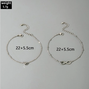 Detail of silver rhinestone anklets with heart and infinity pendants and dimensions