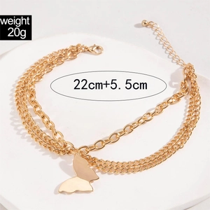 Detail of triple-layer gold anklet with butterfly pendant and 22cm extension chain