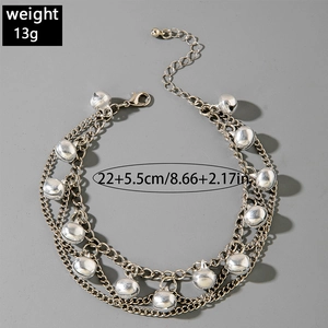 Detail showing 3-layer silver anklet with round bells, 22cm plus 5.5cm extender