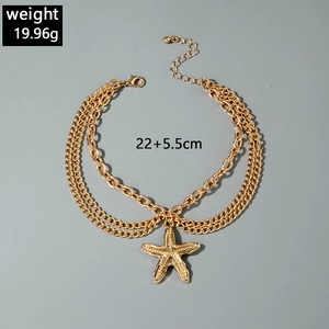 Detail view of gold triple-layer anklet with starfish charm and size specifications