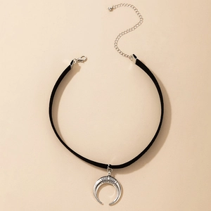 Detail of black velvet choker with textured silver horn pendant and adjustable clasp