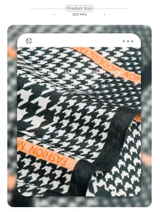 Detail of 70x70cm houndstooth scarf showing polyester texture and orange stripes