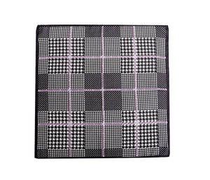 Detailed flat lay of black and white houndstooth scarf with modern fashion typography
