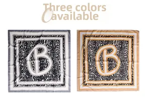 Detail of leopard print silk scarves with luxury chain patterns and letter B motifs