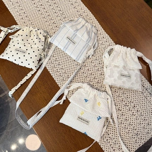 Polka dot and lace drawstring crossbody bags in four stylish patterns and textures