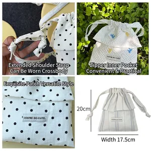 White drawstring crossbody bag with polka dots, bird embroidery and blue stripe options