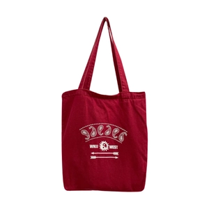 Large red washed canvas tote bag with vintage paisley print and durable cotton handles