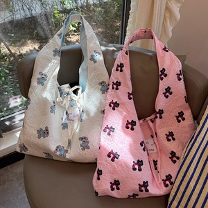 Detail of Korean style tote bags with bear and cat prints on bubble crinkle fabric