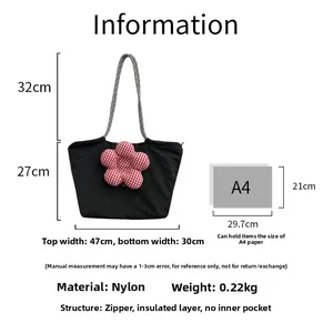 Detail view of the black nylon insulated lunch tote showing exact size measurements