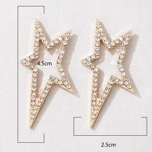 Detailed view of gold star earrings with pavé crystals showing 4.5cm and 2.5cm dimensions