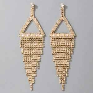 Detail of long gold earrings with geometric triangles and cascading rhinestone tassels