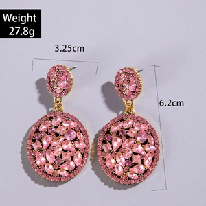 Detailed size view of gold earrings with pink rhinestones, 6.2cm height and 3.25cm width