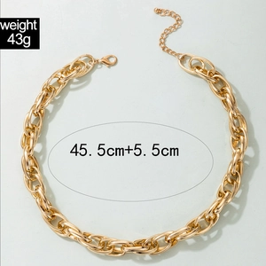 Detail of chunky gold alloy chain necklace showing lobster clasp and adjustable length