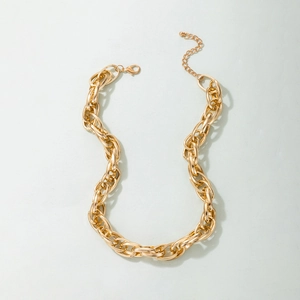 Close-up of golden heavy chunky chain necklace with lobster clasp and extension chain