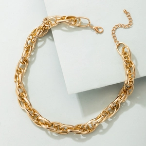 Detail of chunky gold alloy chain necklace with large oval links and lobster clasp