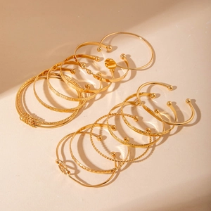 Detailed set of 12 gold-plated alloy bracelets with geometric and bohemian designs