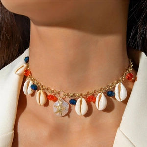 Close-up of beaded shell choker necklace with a gold starfish pendant and colorful crystals