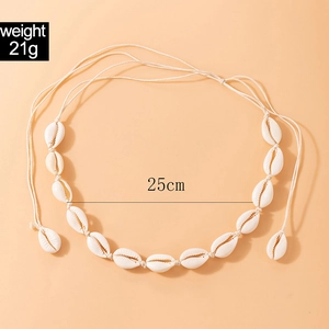 Handmade cowrie shell necklace detail showing 25cm length and 21g lightweight design