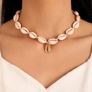 Bohemian seashell beaded necklace with a central golden shell pendant for beach vacations