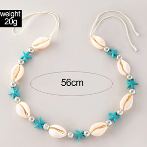 Detail of beaded shell necklace with blue starfish charms and silver beads, 56cm length