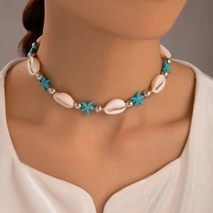Close-up of beach shell choker with starfish turquoise beads on a female model