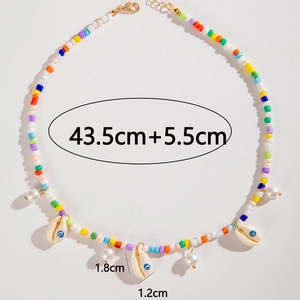 Detailed view of colorful beaded necklace with shell pendant and starfish charms