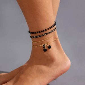 Bohemian gold and black multilayered beaded anklet set with cherry charm for women