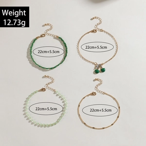 Detail of red bead multilayer anklet set featuring cherry charms and weight specifications