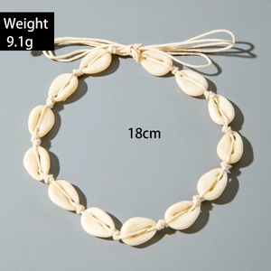 Detail of shell necklace showing 9.1g weight and 18cm length with adjustable cord