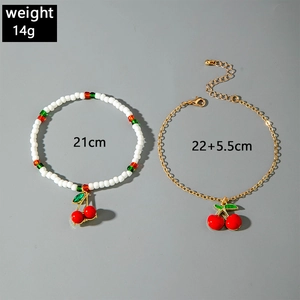 Detail of red cherry pendant anklets with bead length 21cm and 22+5.5cm, weight 14g