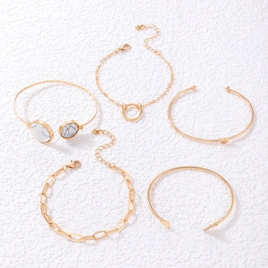 5-piece gold bangle set with geometric triangle and heart charms with marble stone