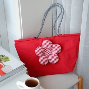 Red high-capacity insulated lunch bag with checkered flower patch and braided handles