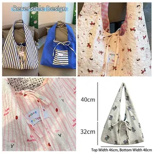 Reversible cartoon bear pleated shoulder bag with floral print and drawstring closure