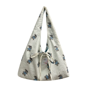 White textured tote bag with cute cartoon bears and bow closure for daily casual use