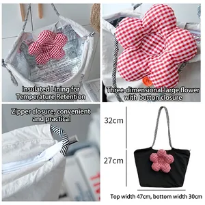 Quilted floral lunch tote with insulated foil lining and secure zipper button closure