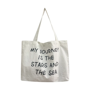 White nylon tote bag with black slogan print for minimalist summer commuting and daily use